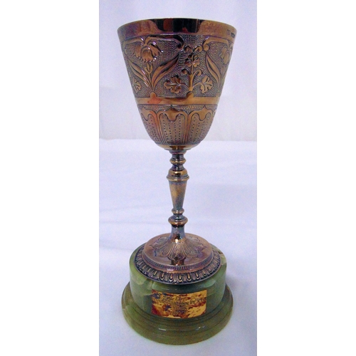 389 - A hallmarked silver presentation trophy goblet engraved and embossed in Renaissance style mounted on... 