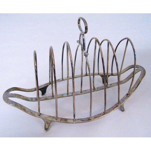 393 - George III hallmarked silver seven bar toast rack shaped oval with pierced oval handle all on four b... 