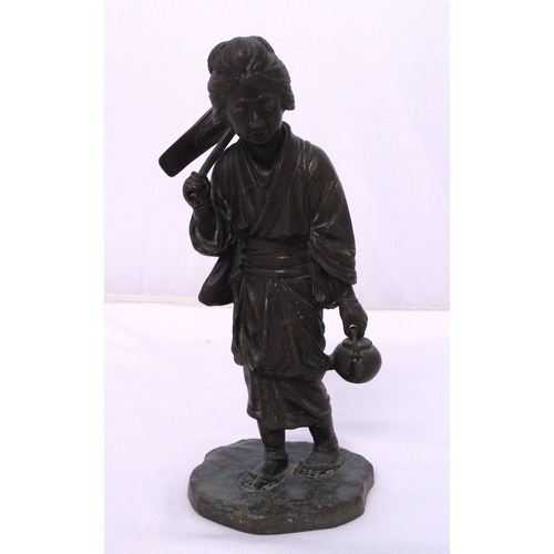 154 - A Chinese 19th century bronze figurine of a lady carrying a teapot and a hoe, signed to the base, 25... 