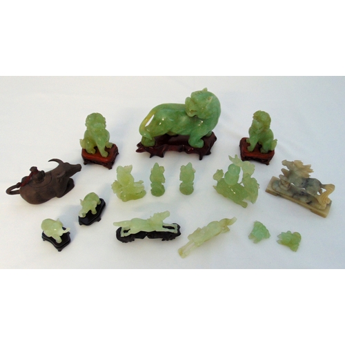 157 - A quantity of jadeite and green hard stone figurines to include Dogs of Foe, Horses and carved hardw... 
