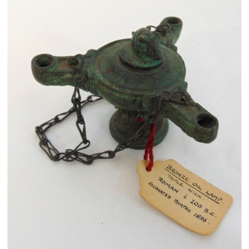 174 - Roman circa 100BC bronze oil lamp, triple wick with pull off cover and mouse finial. 6.5cm (h)