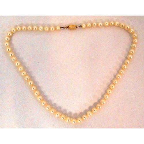 275 - A strand of cultured pearls with a gold clasp