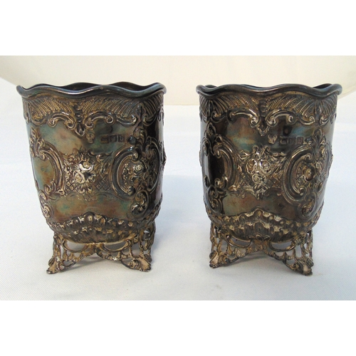 330 - A pair of Victorian hallmarked silver spill vases, cylindrical chased with scrolls, flowers and leav... 