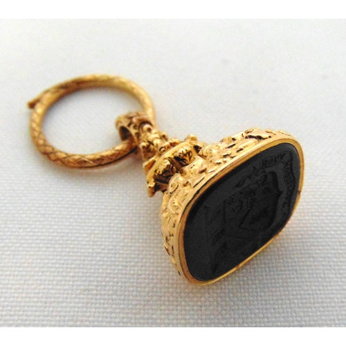 254 - A mid 19th century gold and carved black onyx seal with suspensory loop in the form of a serpent, ap... 