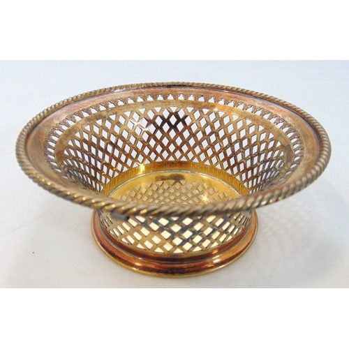 250 - A hallmarked silver gilt circular bonbon dish with lattice pierced sides, rope twist border, Sheffie... 