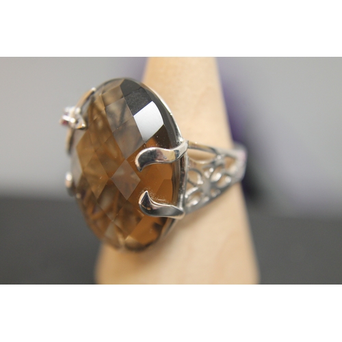 134 - 925 silver flower detail and large smoky quartz stone ring size M