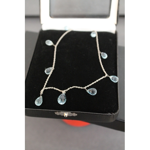 148 - Boxed 925 silver chain with sky blue topaz droplets