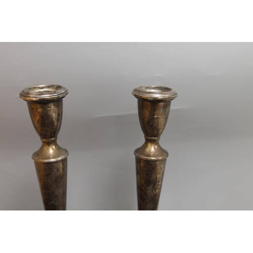 242 - Reed & Barton Sterling silver weighted and reinforced candlesticks,one A/F weight 582 gms