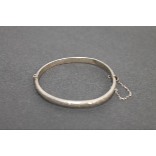 297 - Hallmarked silver engraved bangle with clasp and chain