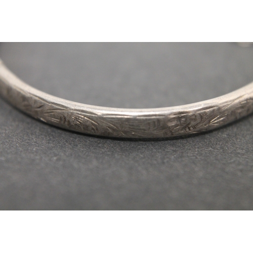 298 - Hallmarked silver engraved Charles Horner bangle with clasp and chain