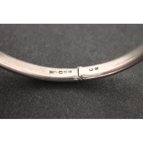 298 - Hallmarked silver engraved Charles Horner bangle with clasp and chain