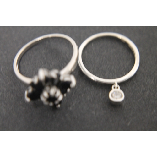 304 - 925 silver black stone flower ring size U and a 925 silver band ring with clear stone size R