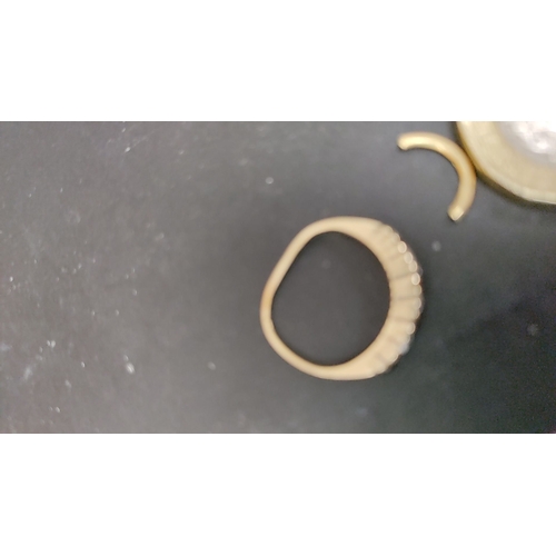 613 - 375 gold ring with black and clear stones size H and a scrap piece of 375 gold total weight  1.50 gm... 