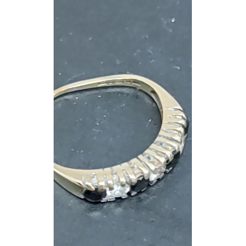 613 - 375 gold ring with black and clear stones size H and a scrap piece of 375 gold total weight  1.50 gm... 