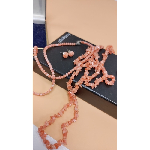 615 - 2 x coral bead necklaces and earrings set in original box, featuring intricately carved floral desig... 