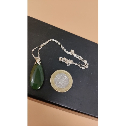 620 - Sterling silver necklace with a teardrop jade pendant and fine chain detail. Measures 16" lengt... 