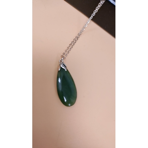 620 - Sterling silver necklace with a teardrop jade pendant and fine chain detail. Measures 16" lengt... 