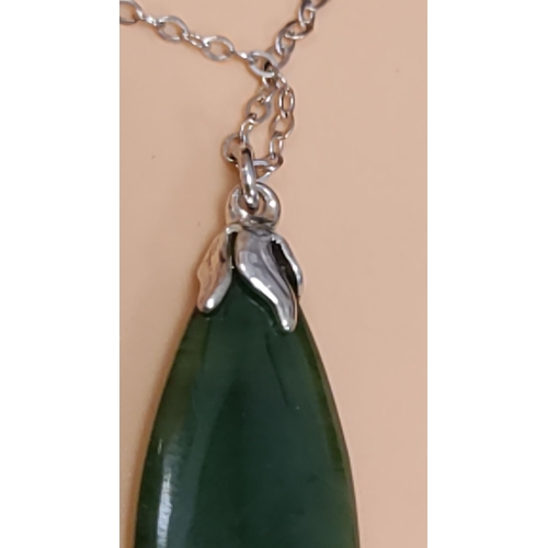 620 - Sterling silver necklace with a teardrop jade pendant and fine chain detail. Measures 16" lengt... 