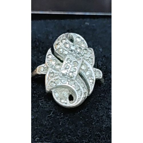 622 - Sterling silver marcasite cocktail ring, features intricate swirling design. Hallmarked "SIL.&q... 