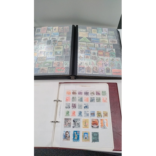 13 - Two stamp albums with stamps from around the world inc Europe, Africa and Singapore and the commonwe... 