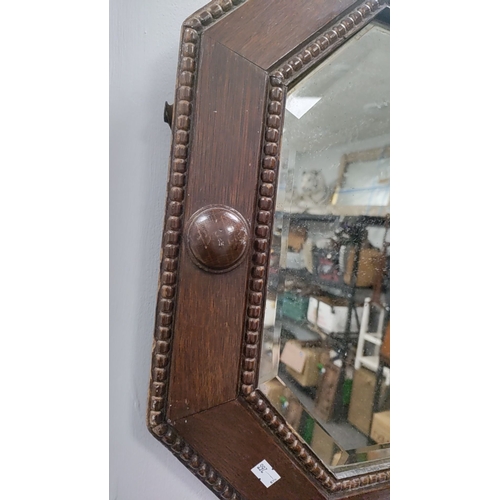 196 - Edwardian oak framed bevel edged mirror 49cm x 80cm