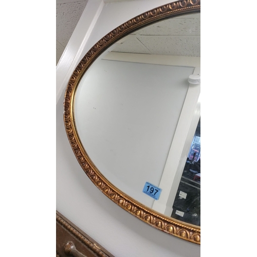 197 - Oval gilt resin framed bevel edged mirror 50cm x 72cm