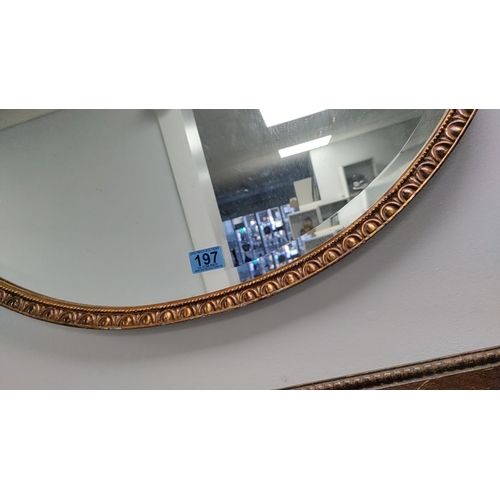 197 - Oval gilt resin framed bevel edged mirror 50cm x 72cm