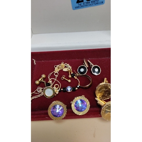 267 - Red velvet box of cufflinks and other yellow metal jewellery