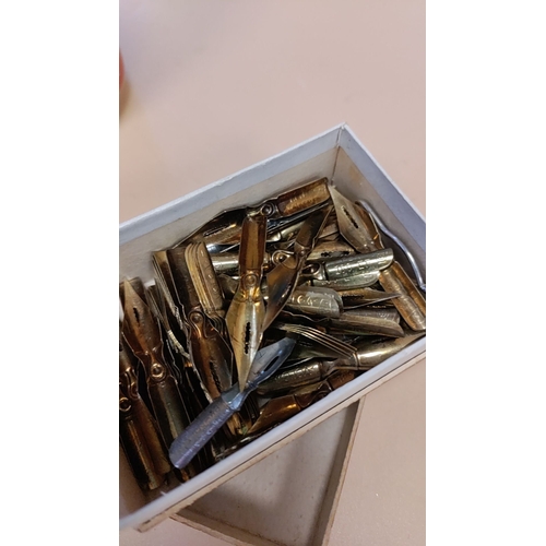 271 - Job lot of yellow metal and white metal pen nibs