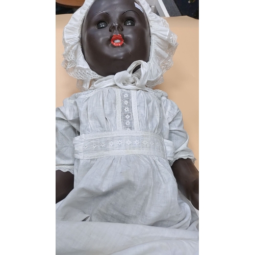 28 - Antique Black hand painted baby doll with moving limbs