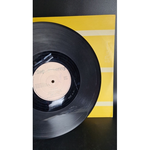 302 - Vinyl record by Fire and Ice titled "Love or Physical," under Top Priority label. Includes... 