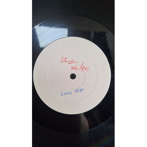 322 - Vinyl record features a white label with indescribable unknown artist  red text, song is Love Trap T... 