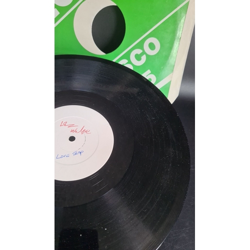 322 - Vinyl record features a white label with indescribable unknown artist  red text, song is Love Trap T... 