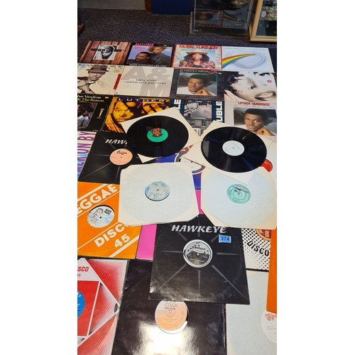 374 - Joblot of vintage 12-inch vinyl records featuring various genres, including reggae and soul. Notable... 