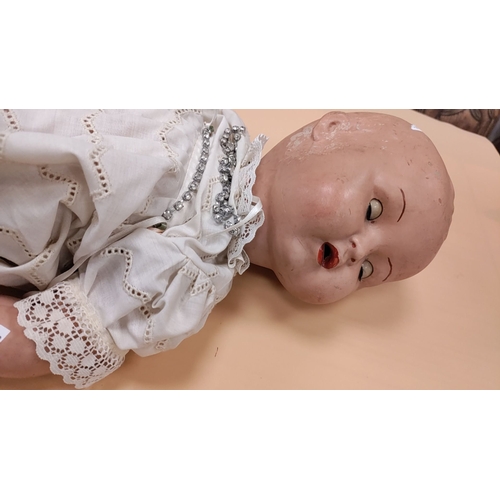 38 - Antique hand painted baby doll with moving limbs