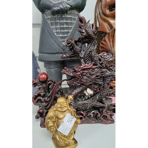 44 - Terracotta soldier, oriental dragon figure, mini Buddha figure and three Singapore lion figures