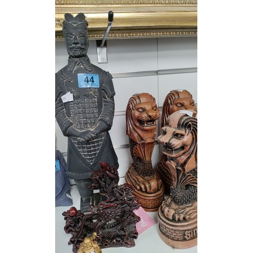 44 - Terracotta soldier, oriental dragon figure, mini Buddha figure and three Singapore lion figures