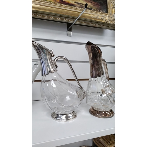 46 - Two Duck decanters with silver plated finish