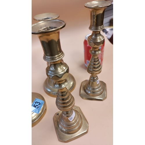 53 - Two pairs of brass candlesticks