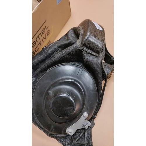 69 - Gas Mask with two filters and a leather MiG-29 cold war jet helmet