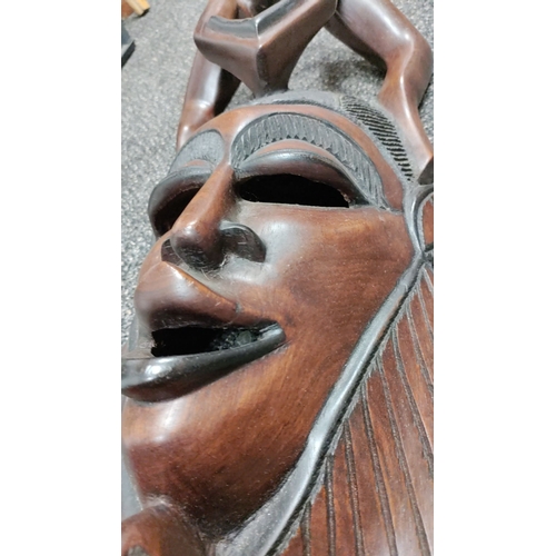 76 - Large hand carved heavy solid African tribal wall mask