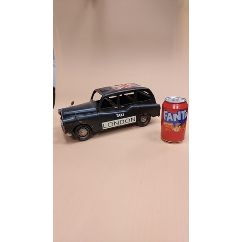 84 - Model tinplate London taxi cab