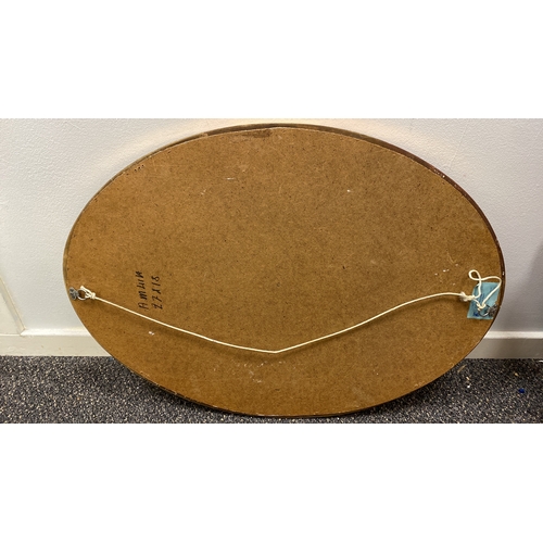 197 - Oval gilt resin framed bevel edged mirror 50cm x 72cm