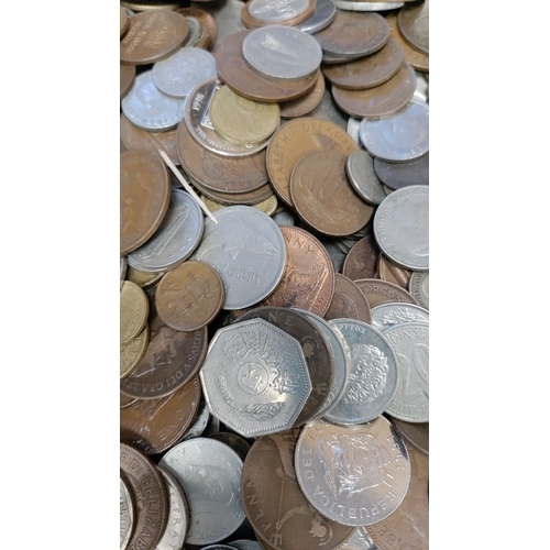 282 - Large tin of British coins and coins from around the world