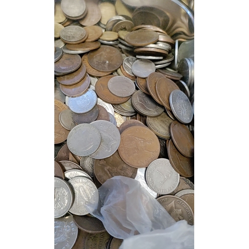 282 - Large tin of British coins and coins from around the world