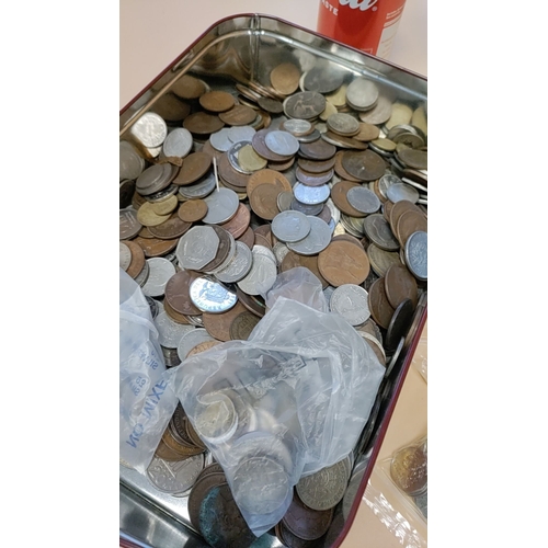 282 - Large tin of British coins and coins from around the world