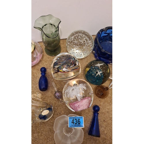 436 - Collection of glassware to include 4 paperweights, vases, candle holders, and small scent bottles. S... 