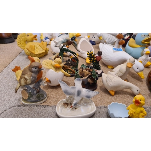 437 - Large collection of over 40 ornamental ducks and other birds. Ceramic, resin and rubber.