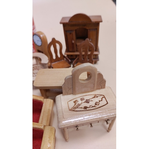 449 - Collection of wooden dolls house furniture