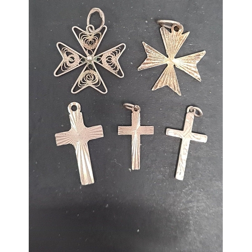 487 - 5 assorted silver crosses